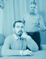 Adult father teaches his son