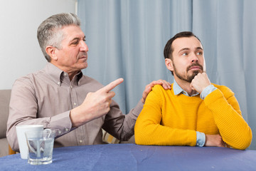 Mature father and son serious talk