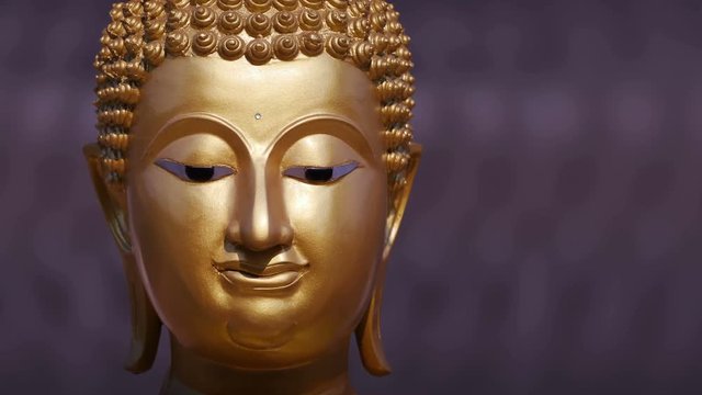 Golden Buddha statue close up ,Panning