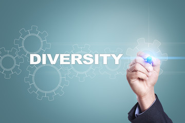 Businessman drawing on virtual screen. diversity concept.