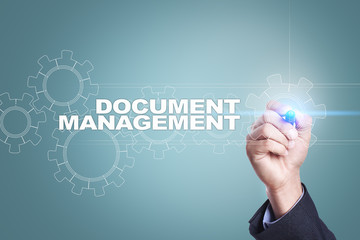 Businessman drawing on virtual screen. document management concept.