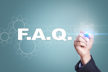 Businessman drawing on virtual screen. f.a.q. concept.