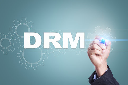 Businessman drawing on virtual screen. drm concept.
