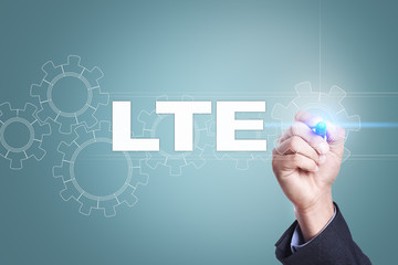 Businessman drawing on virtual screen. lte concept.