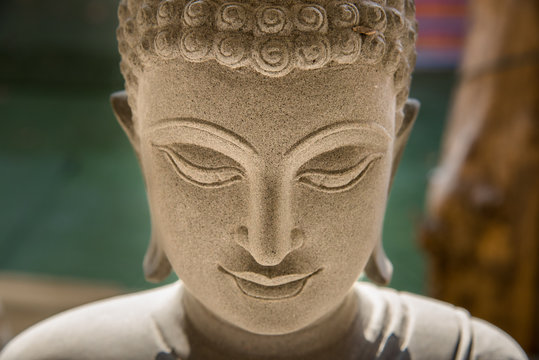 Ayutthaya, Thailand - March, 11, 2017 : Close up face of Buddha sandstone statue in Wat cheing len temple Thailand.