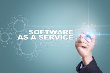 Businessman drawing on virtual screen. software as a service concept.