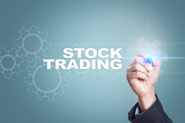 Businessman drawing on virtual screen. stock trading concept.