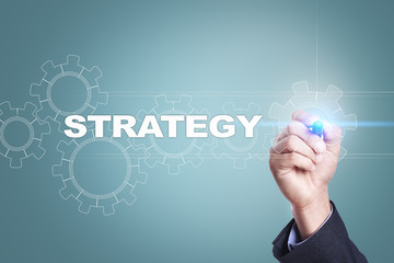 Businessman drawing on virtual screen. strategy concept.