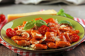 Ravioli with tomato sauce and basil