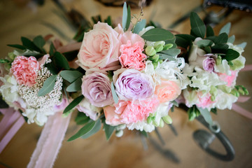 Pink wedding bouquets lie on glass table