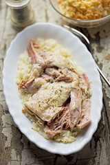 Chicken poached with rice and white sauce