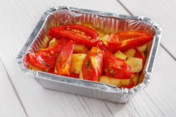 Healthy food in foil boxes, diet concept.