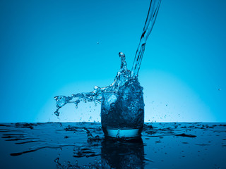 Сreative splashing water in the glass