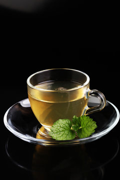 Herbal dry sri lanka tea. Mint leaf. Tea in a glass cup, mint le