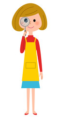 虫メガネをのぞくエプロンの女性 