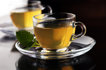 Herbal dry sri lanka tea. Mint leaf. Tea in a glass cup, mint leaves, dried tea, in a restaurant or teahouse
