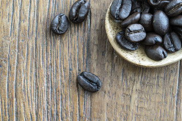 closeup of coffee in wooden spoon