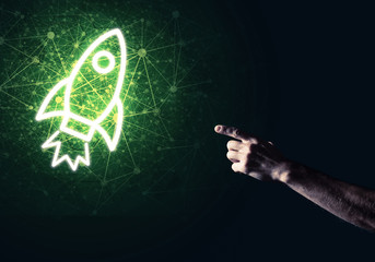 Man palm presenting Rocket web icon as technology concept