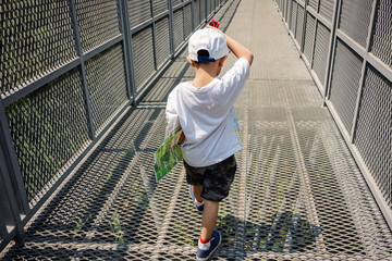 little kid with Canopy Walk in a Subtropical Forest