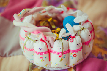 Easter basket made of soft toy rabbits