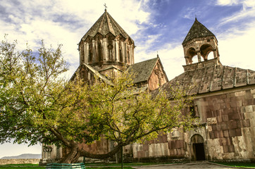 Monastery of St.John the Baptist in Gandzasar and yellowed old tree  at the entrance 
