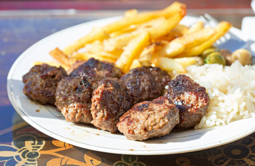 Lamb kofta with rice and fries