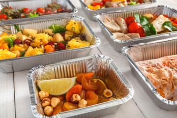 Healthy food take away, top view at wood background