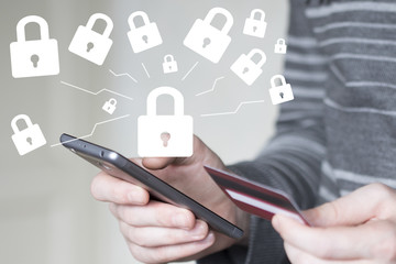 Businessman on phone confirms lock security purchase credit card