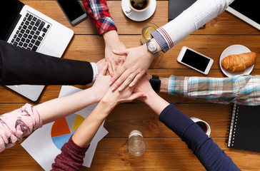 United hands teamwork in office concept