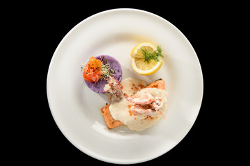 salmon fillet with champagne sauce and purple potatoes