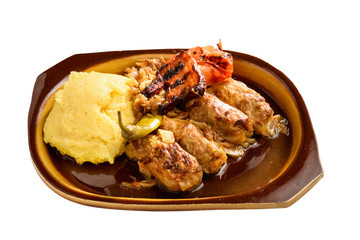meat rolls sarmale in clay bowl isolated
