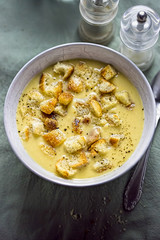 Sour cucumber cream soup with croutons