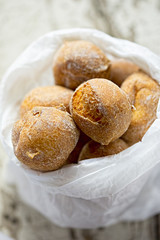 Mini doughnuts in paper bag