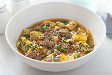 Slow cooked beef in gravy, topped with buttery potato and onion hash