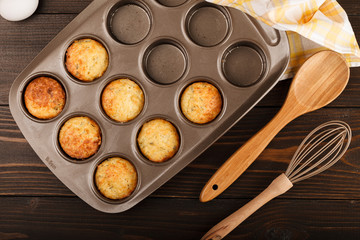 Muffins with cheese on dark wood backgroud