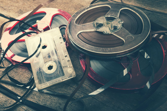 retro audio reels and cassette on old wooden table
