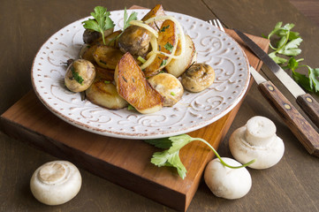 Fried potatoes with mushrooms, onions, parsley.