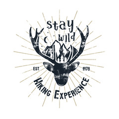 Hand drawn vintage camping badge and hiking label with hiking design elements and typography - stay wild. Vector design