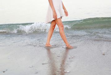 beach travel woman walking on sand beach