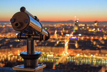 Telescope and view at the city of Lyon, France, at dawn. Shallow D.O.F.