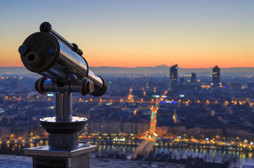 Fototapeta na wymiar Telescope and view at ther city of Lyon, France, at dawn. Shallow D.O.F.