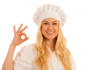 Beautiful young chef woman shows ok sign as she is happy with deliceous meal