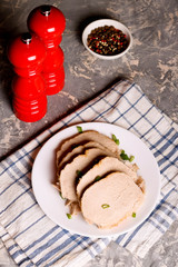 Roast pork with herbs on a plate