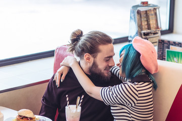 Couple Cuddling at Fast Food Restaurant