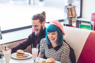 Couple Laughing at Fast Food Restaurant