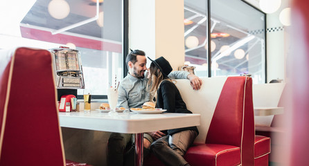 Couple in Love Cuddling in Diner Restaurant