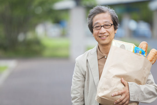Mature man with groceries