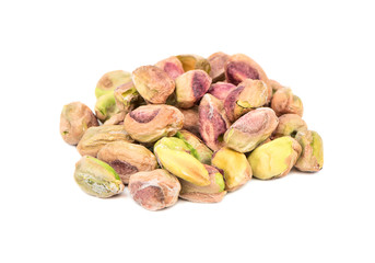 Pile of pistachio nuts without shell on a white background