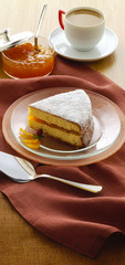 cake filled in jam and a coffe