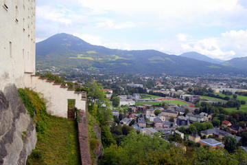 Naklejka premium Travel to Salzburg, Austria. The view on the city and the roofs of houses near to mountains.